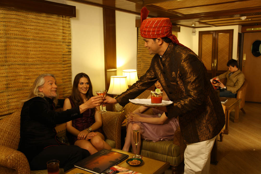 Guests are served drinks at Rajah Club Maharajas Express Staff