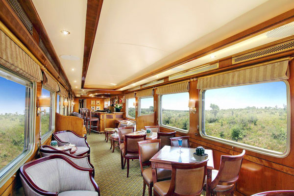 How do the Deccan Odyssey and the Blue Train compare at a glance